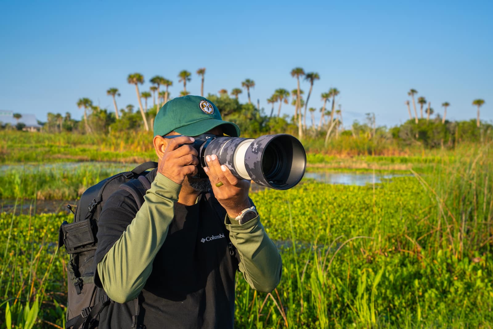 Florida wildlife photographer Satesh Ramjattan in the field taking photos